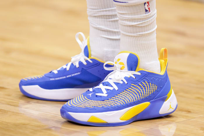 View of Luka Doncic's blue, white, and gold shoes.